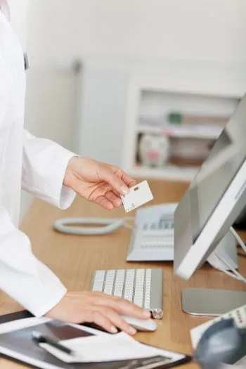 person entering information into a computer
