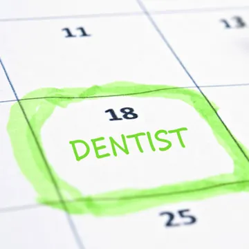 calendar with dentist written on a day of the week